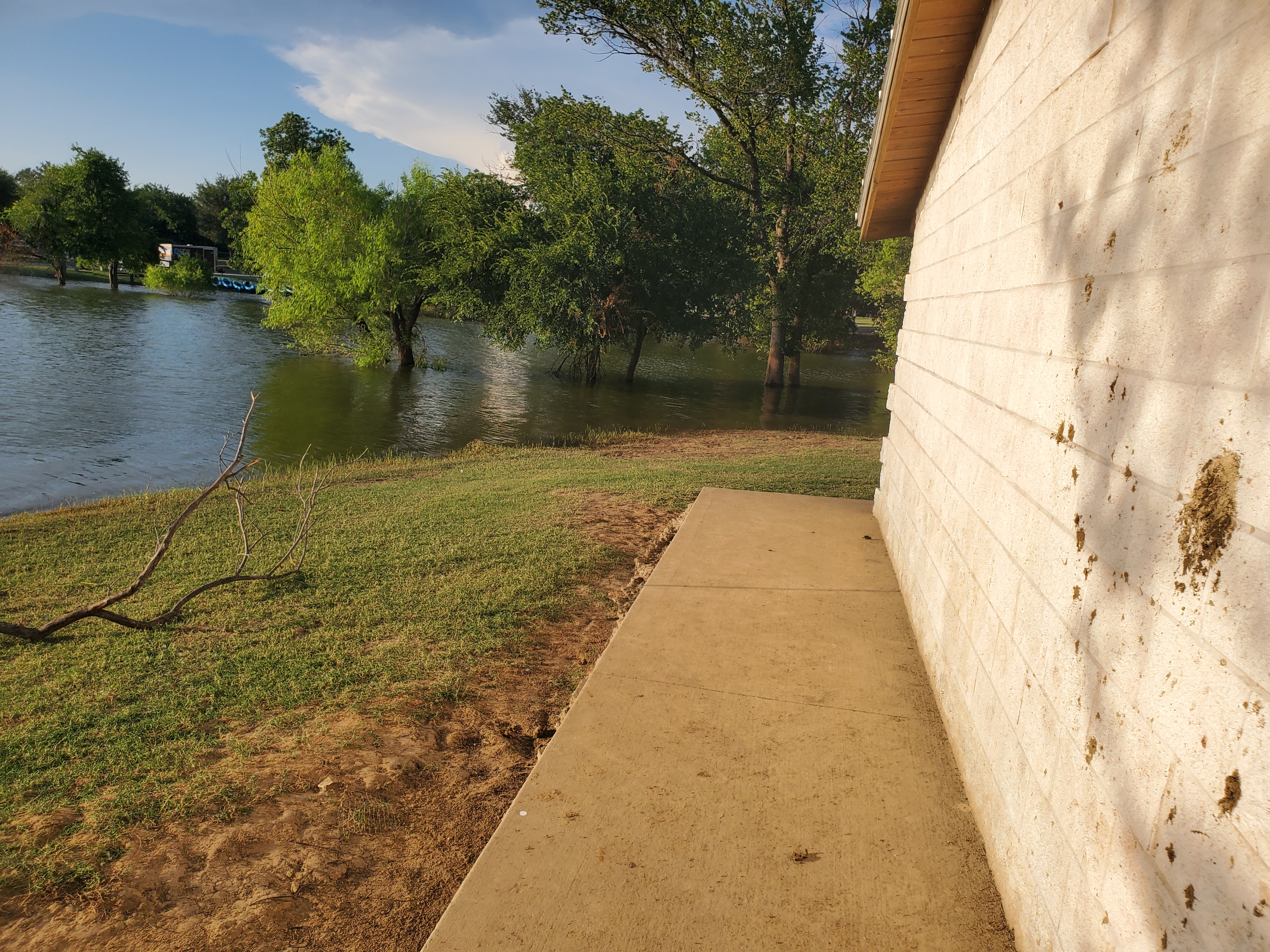 The water catches up to a nearby building. Lucky that place won’t be getting wet.