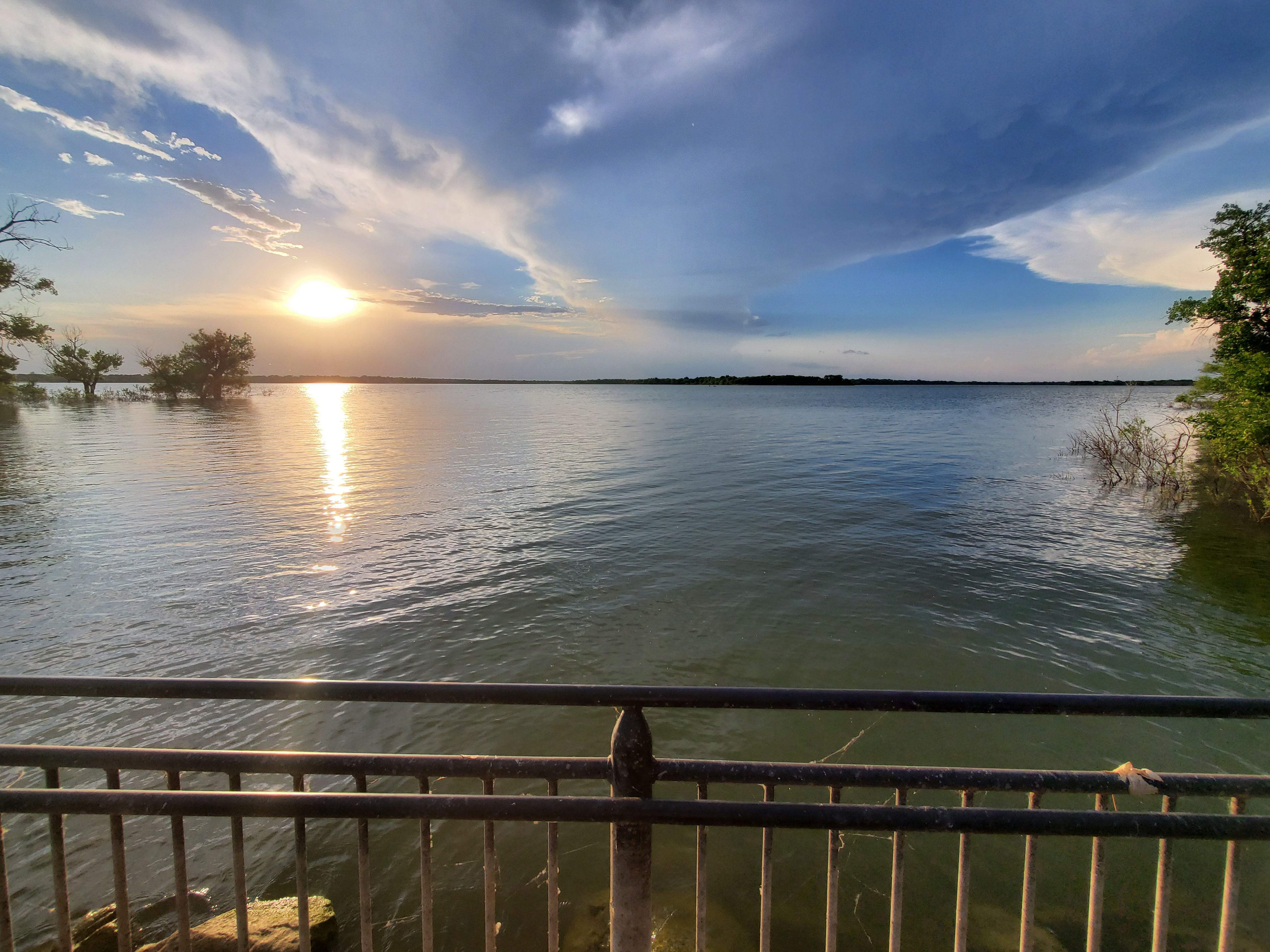 A final view of the lake from the sidewalk, as well as some more submerged trees. The water touches the sidewalk!